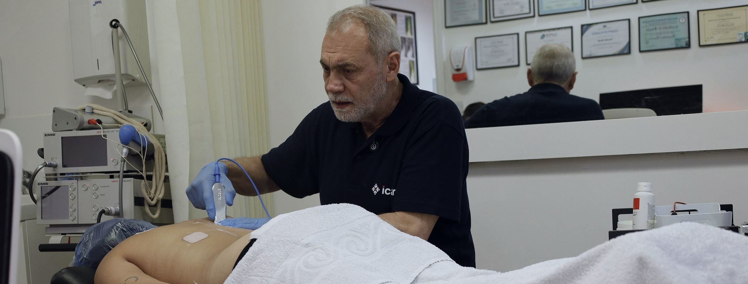 An MSK specialist at PRC Clinic giving hands-on treatment to a patient's back.